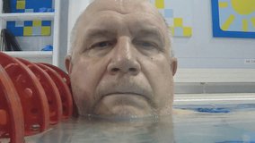 male swimming coach in water pool - Powered by Shutterstock - Get 15% off with code: PIKWIZARD15