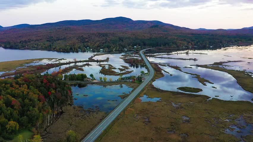 Tupper Lake in Adirondack, NY State, Moody Section, Spectacular Sunset in Fall aerial drone