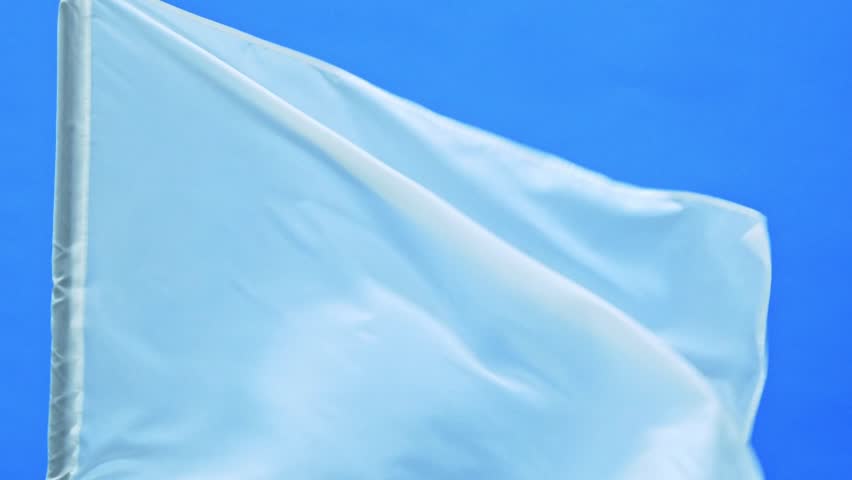 Slow motion video of white flag waving on blue background
