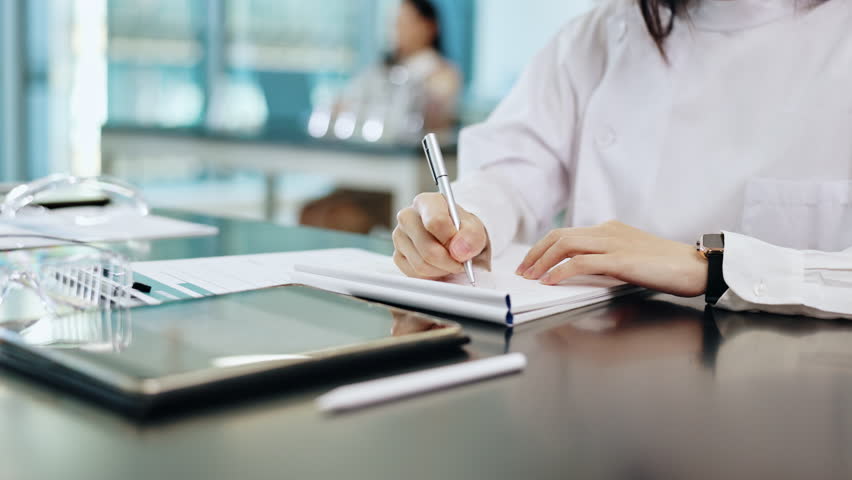 Science, hands and woman writing notes, results or studying for test at Japanese medical college. Laboratory, education and university student in class with notebook, pen and research ideas for exam.