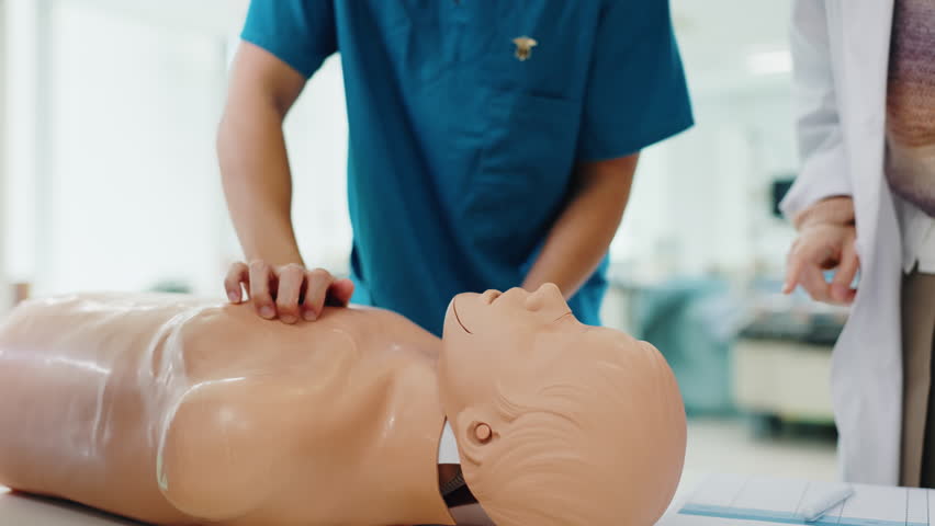 Doctor, student hands and CPR training in hospital with professional advice, rescue support or medical simulation. Healthcare education, people and model for life saving demonstration in Japan clinic