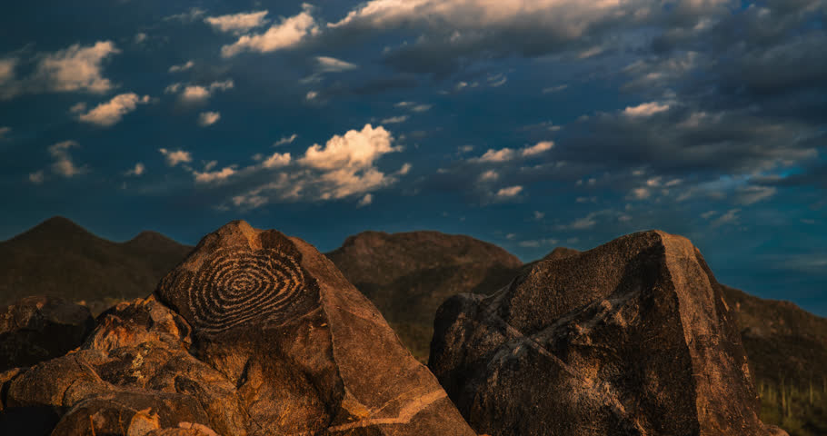 Petroglyph panel on Signal Hill in Saguaro National Park with interesting cloudlets that roil and dance in place after a summer storm.