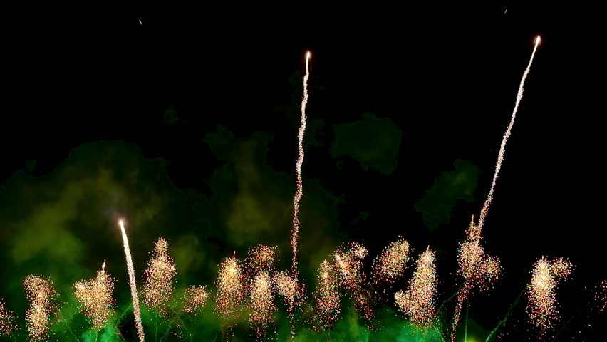  4K. loop seamless of real fireworks background golden shining fireworks with bokeh lights in the night sky. glowing fireworks show. New year