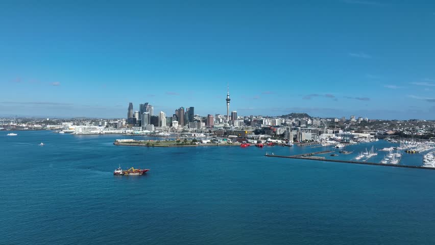 Panorama Flight through Auckland , New Zealand. Skyline. New Skyscrapers. Urban Canyon. Aerial Pedestal in Establishing Drone Shot. Glowing street lights 