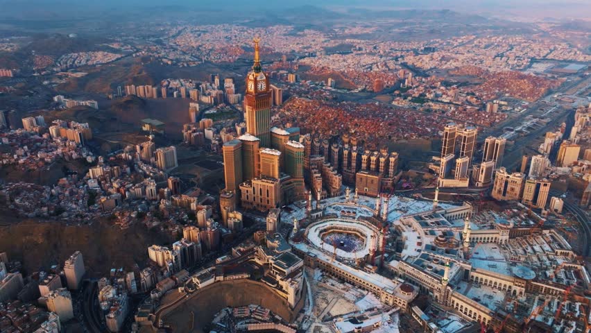 Aerial view of the Grand Mosque with the Kaaba, Islam’s holiest site, and the Abraj Al-Bait Clock Tower illuminated by early morning sunlight in the holy city of Mecca