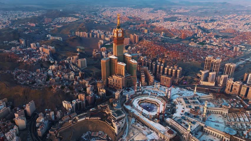 Aerial view of the Grand Mosque with the Kaaba, Islam’s holiest site, and the Abraj Al-Bait Clock Tower illuminated by early morning sunlight in the holy city of Mecca