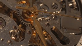 Detailed macro shot of intricate mechanical watch gears and golden hands in motion, showcasing precision engineering. Ideal for concepts related to time, luxury, craftsmanship, and horology.  - Powered by Shutterstock - Get 15% off with code: PIKWIZARD15