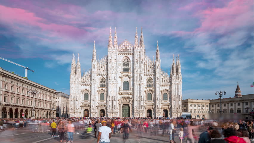 Historic landmark Duomo Cathedral at sunset in Milan, Italy, time lapse hyperlapse footage milano city italy downtown.