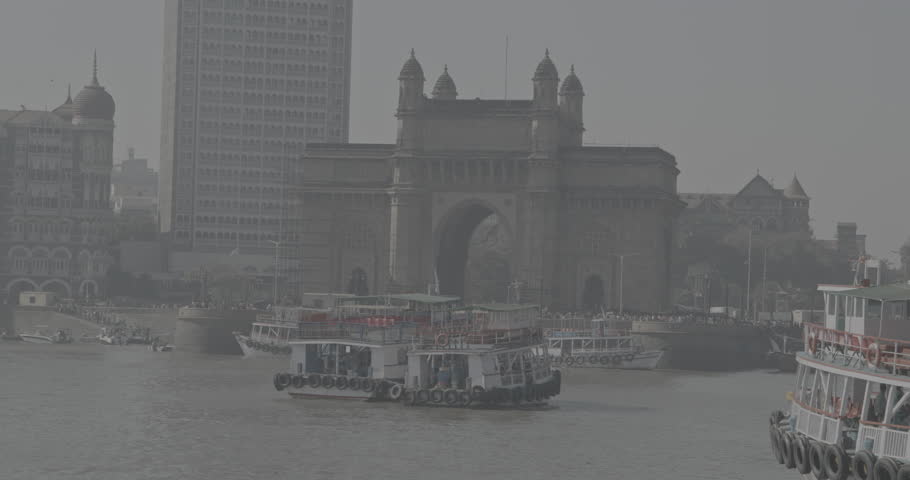 Mumbai, India. Ungraded C LOG 2 Many Boats with Tourists floating on the Arabian Sea. Tourists boats floating near Taj Mahal Palace hotel and Gateway of India. Cityscape skyline of Mumbai. Erected to