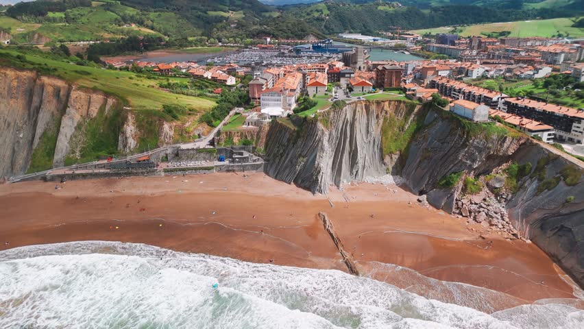 Aerial view of the beautiful Itzurun beach, Zumaia town, Basque country, north of Spain. Itzurun beach is famous for the longest set of continuous rock strata in the world