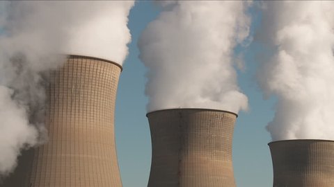 Hyperboloid cooling towers emit steam at the Bruce Mansfield Power Station, a coal-fired power station owned and operated by FirstEnergy on the Ohio River near Shippingport, Pennsylvania.