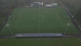 Aerial view of a soccer practice session on a rainy day at a local field in a small town - Powered by Shutterstock - Get 15% off with code: PIKWIZARD15