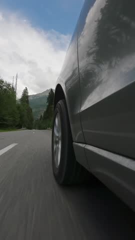 Car driving on scenic road side view