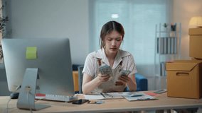 Asian woman entrepreneur is experiencing financial difficulties and getting frustrated with her business - Powered by Shutterstock - Get 15% off with code: PIKWIZARD15