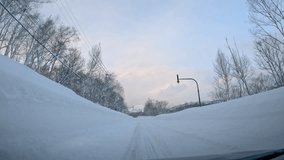 Empty winter road surrounded by towering snowbanks leads towards snowy Mount Yotei. Trees and road are covered with fresh snow, which promises amazing day for powder riding in Japanese mountains. - Powered by Shutterstock - Get 15% off with code: PIKWIZARD15