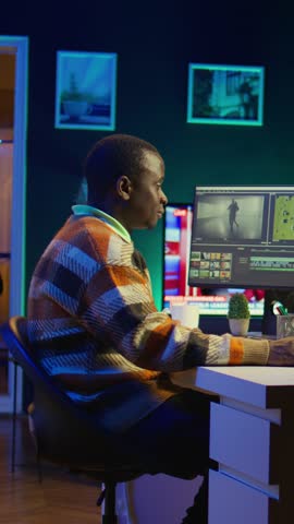 Vertical Video Video editor working on creative software to create a film montage, using color correction wheel and adding visual effects. Male creator editing gradient for movie post production