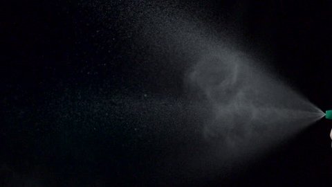 Using spraying bottle and cleaning on black background shooting with high speed camera, phantom flex.