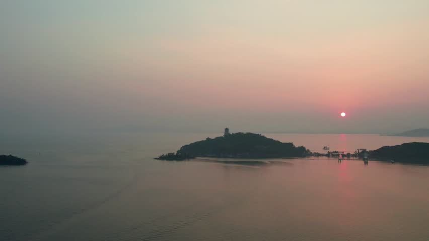Drone view of sunset landscape of fairy islands or three mountains island of Lake Tai in Wuxi, China. High angle view of peaceful landmarks in Lake Tai, 4k real time footage.