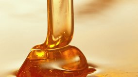 Super Slow Motion Detail Shot of Pouring and Layering Premium Honey at 1000fps. - Powered by Shutterstock - Get 15% off with code: PIKWIZARD15