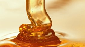 Super Slow Motion Detail Shot of Pouring and Layering Premium Honey at 1000fps. - Powered by Shutterstock - Get 15% off with code: PIKWIZARD15