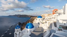 Sunrise above Beautiful Oia town on Santorini island, Greece. Scenic Caldera travel time lapse. Iconic white buildings and blue dome churches.	 - Powered by Shutterstock - Get 15% off with code: PIKWIZARD15