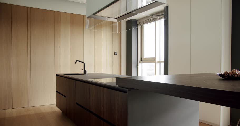 Light Wood Wall and Floors. Modern kitchen and bar brown chairs in kitchen room in minimalist apartment. Modern Kitchen room with minimalist dining table. kitchen room with dining area of natural wood