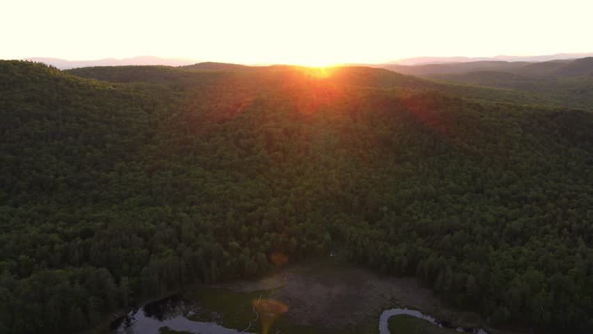 Aerial drone footage of the Adirondack Mountains and Lake George at sunset. Stunning landscapes, vibrant colors, and cinematic views perfect for travel, nature, and outdoor adventure projects 