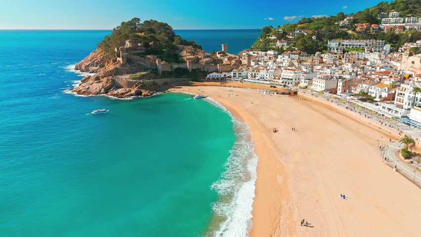Tossa de Mar town on Costa Brava Mediterranean coast in Catalonia, Spain. Beautiful beach with turquoise color water and Tossa de Mar fortress during summer in Catalonia.