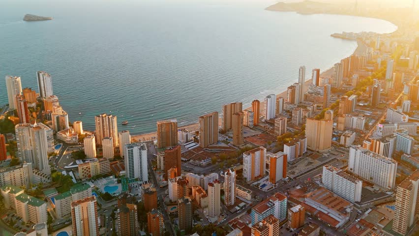 Aerial view of the Benidorm cityscape at sunset, Valencian Community, Costa Blanca, Spain. Skyscrapers of Benidorm resort city at the Eastern coast of Spain.