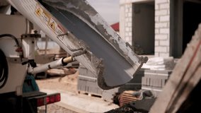 Construction mixer truck pouring concrete at building site - Powered by Shutterstock - Get 15% off with code: PIKWIZARD15