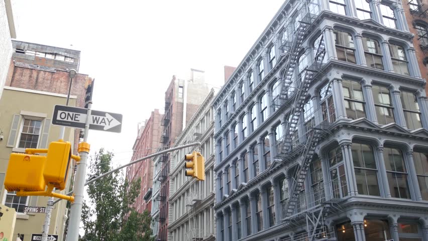 New York City Manhattan Soho fashion district near Broadway street. USA urban building facade, old classic american architecture. Shopping in NYC, United States. Business and residential real estate.