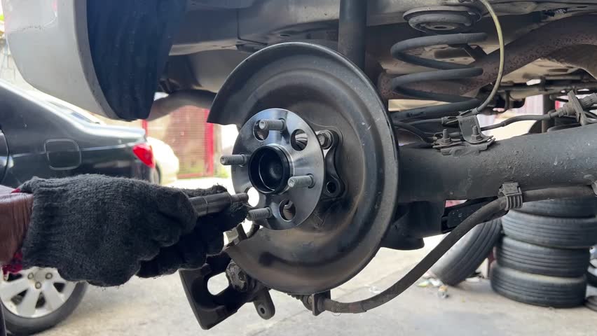 Car Brake Repair Process by Skilled Mechanic at Auto Shop for Optimal Safety