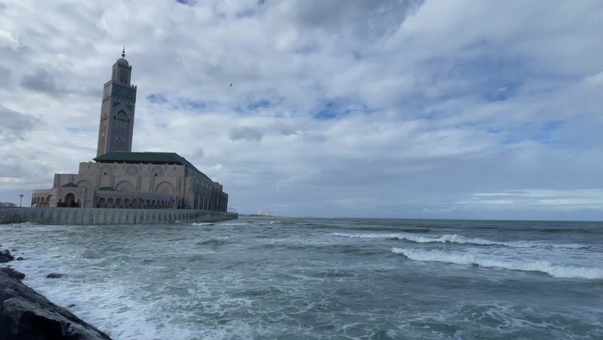 Mosquée Hassan II Mosque and The Ocean Sea Beach Waves in Motion from Maritime Promenade