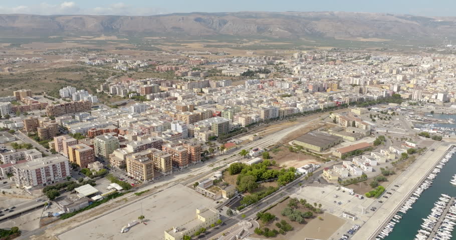 Aerial view of the port and historic center of Manfredonia, located in the province of Foggia, in Puglia, Italy. It is a small town on the Mediterranean Sea.