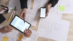 UX UI designers discussing and brainstorming on wireframes for a website and mobile app prototype, in the concept of website and mobile application design concept.  - Powered by Shutterstock - Get 15% off with code: PIKWIZARD15