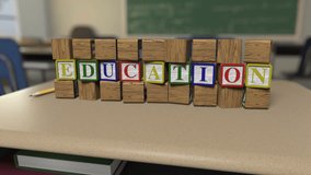 Letter Block Series-"Education"  - Toy letter blocks tumble onto a school desk to form words,  then tumble out of frame - Powered by Shutterstock - Get 15% off with code: PIKWIZARD15