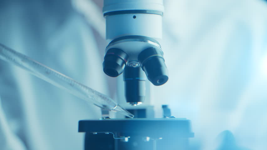 Virologist scientist using microscope in laboratory for biochemical research. Medical lab equipment, doctor researching vaccine development, studying disease to advance healthcare and treatments - Powered by Shutterstock - Get 15% off with code: PIKWIZARD15
