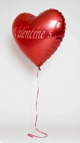 Red heart-shaped balloon with Valentine s text, perfect for celebrating Valentines Day, love, and romance, on a white background.