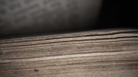 Macro view of flipping pages of antique book. Bible. looking for information from old archival manuscripts. History concept. - Powered by Shutterstock - Get 15% off with code: PIKWIZARD15
