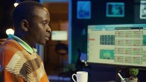 African American man having discussion during online meeting on laptop, talking about internet statistics or data. Freelancer use technology for virtual communication, working remotely. Camera B. - Powered by Shutterstock - Get 15% off with code: PIKWIZARD15