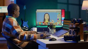Creative african american graphic designer editing images on dual monitors, showcasing talent and dedication to the digital design field in a well organized home workspace. Camera A. - Powered by Shutterstock - Get 15% off with code: PIKWIZARD15