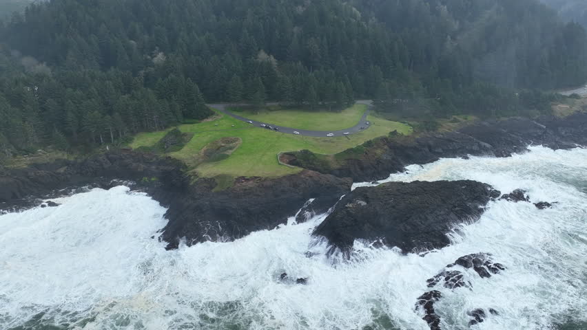 The Pacific Ocean crashes against the rocky and rugged coast of Rocky Creek, Oregon, south of Lincoln City. This part of the Pacific Northwest coast is incredibly scenic and accessed from highway 101.