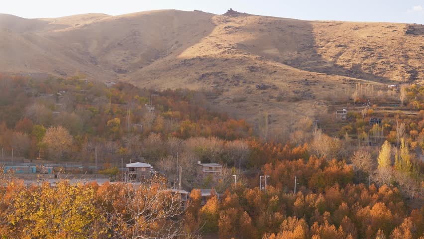 Long shot view of the mountains in autumn
