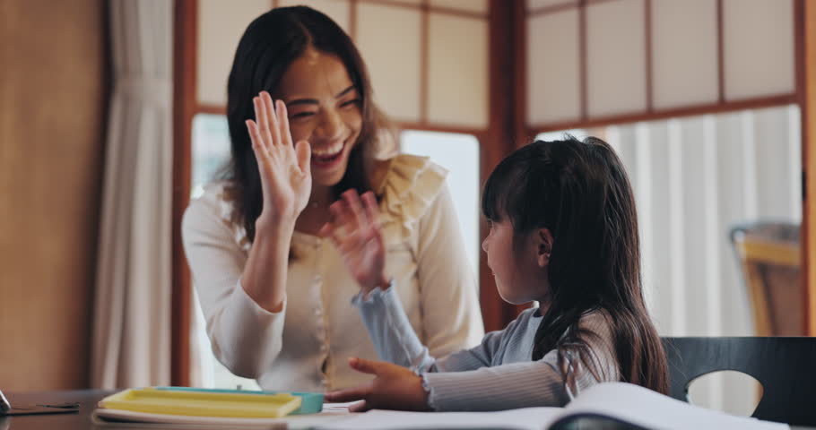 High five, homework and Asian mother with child in home for learning, teaching and maths lesson. Family, success and happy Japanese mom and girl help with education, counting and school project