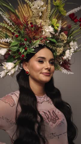 Woman with flower crown in traditional clothes. Concept of traditional clothing.