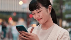 Professional, woman and laughing with phone in city for funny text message and social media meme at night. Japanese person, smartphone and happy outdoor for mobile chat, internet joke or dating site - Powered by Shutterstock - Get 15% off with code: PIKWIZARD15