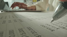 Macro close up of accountant woman working with laptop computer analyzing financial report and data statistics documet in office. Unrecognizable businesswoman checking company balance sheet statement. - Powered by Shutterstock - Get 15% off with code: PIKWIZARD15