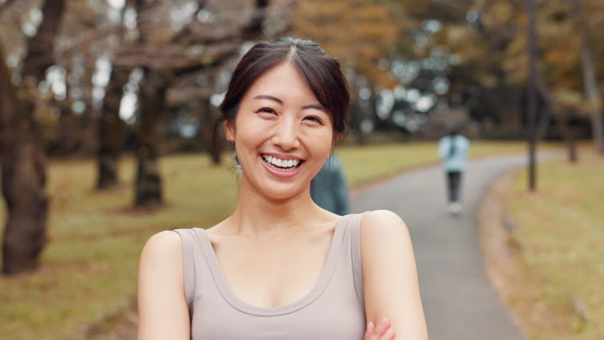 Face, fitness and Japanese woman at park with confidence, laugh and arms folded. Portrait, athlete and Asian girl outdoor with smile, happy and ready to workout for body health or wellness in Japan