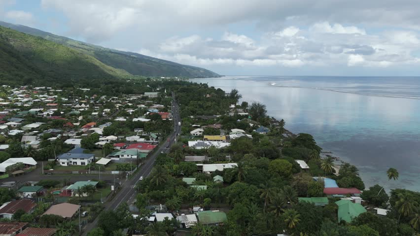 A Town With Tropical Nature At Plage Vaiava Beach In Puna'auia, French Polynesia. Aerial Drone Shot