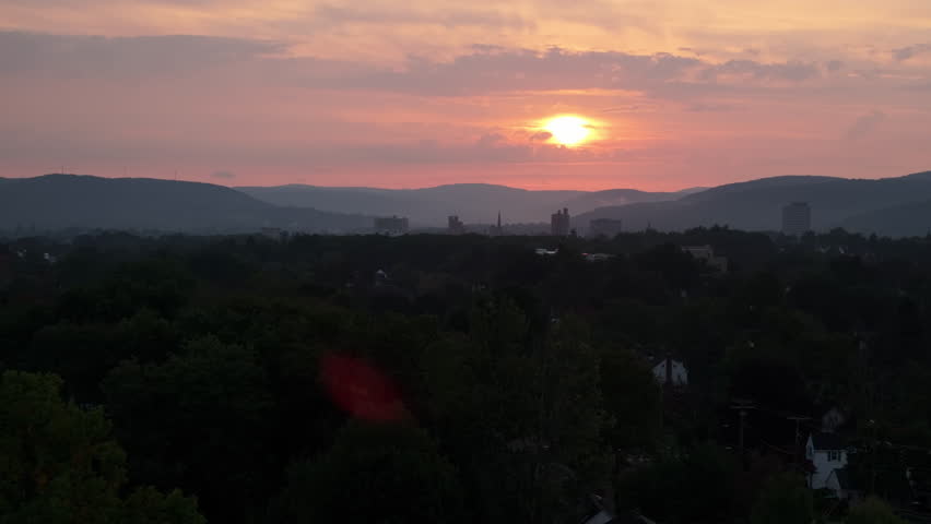Aerial view of Binghamton, New York at sunrise. Shot during the summer in 4k.